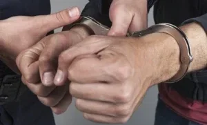 Muncie, IN Surety Bail Bonds 5 A man is releasing other man from handcuff in Muncie, IN.