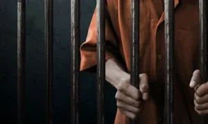 Muncie, IN Surety Bail Bonds 12 A prisoner is standing in the jail in Muncie, IN.
